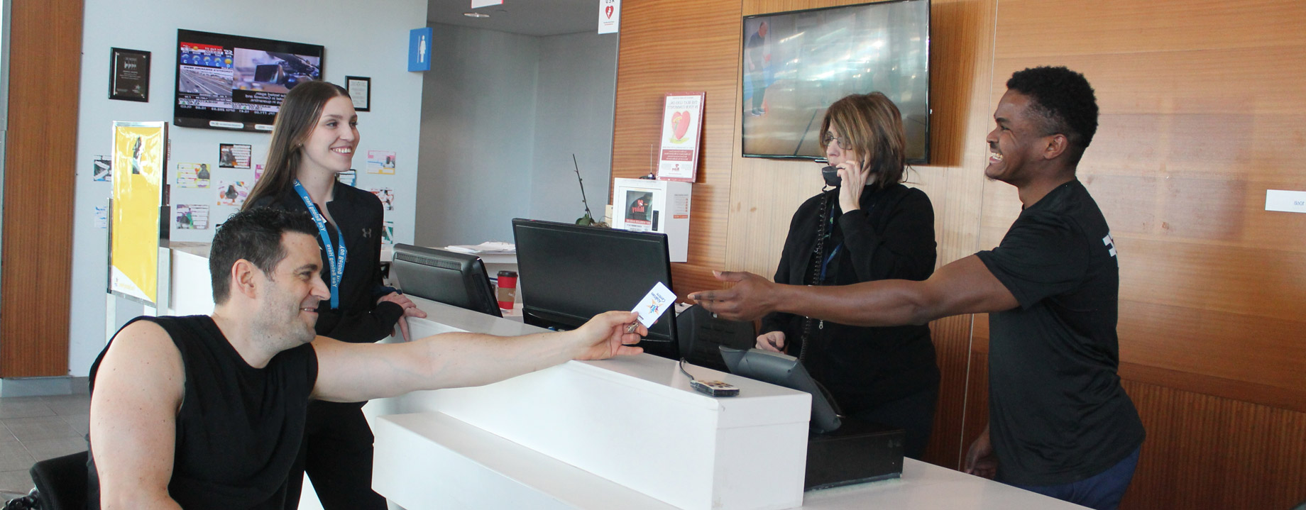 Member greeted by friendly Abilities Centre front desk staff